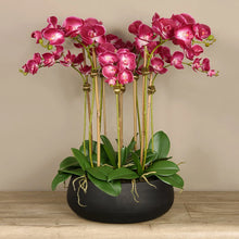 Load image into Gallery viewer, artificial floral arrangement centerpiece with pink orchids in black planter