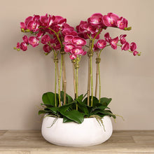 Load image into Gallery viewer, Artificial flower arrangement with pink orchids in white planter