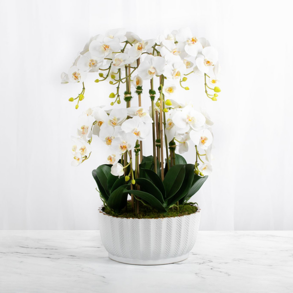 Faux orchid centerpiece - silk orchid arrangement in white vase