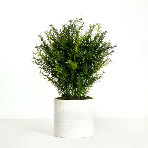 Artificial rosemary plant in white pot