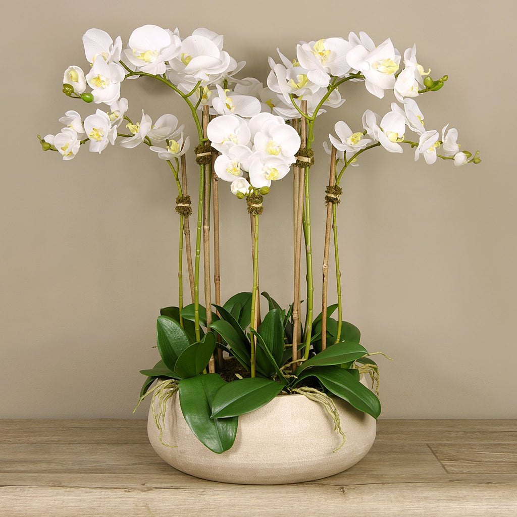 Artificial orchid centerpiece arrangement in beige planter - 28"